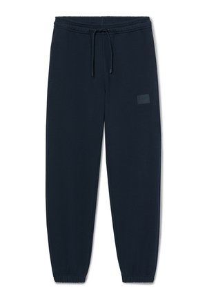 Donker marineblauwe sweatpants met elastische tailleband en boorden, een trekkoord aan de voorkant en een subtiel patchdetail op het bovenbeen.