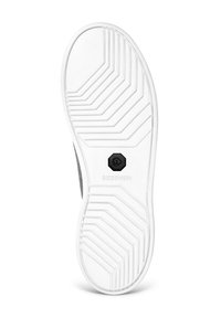 White sneaker outsole with a textured surface, featuring a zigzag pattern and a black emblem at the center labeled "GIESSWEIN."