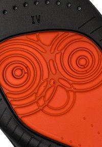 Black and orange shoe insole features a textured surface with circular patterns and raised accents, highlighted by a smooth orange core.