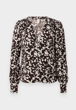 Ruskea ja kerma verkkokuvioinen paita, jossa on V-mallinen kaula-aukko, kerätty olkapää sekä napitusyksityiskohtia. Pitkät hihat ja kireät hihansuut. Pehmeä kangas.