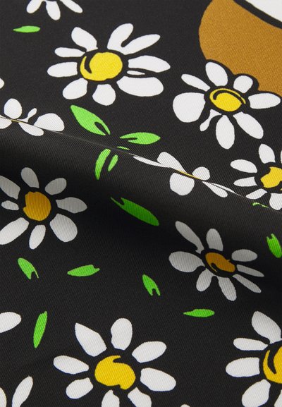 Black fabric featuring white daisies with yellow centers and green leaves, displaying a smooth texture and a floral pattern.