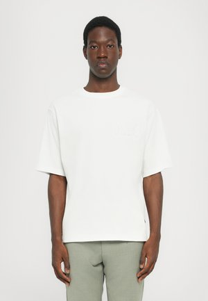 White short-sleeve T-shirt with a crew neck, featuring a subtle embossed "MK" logo on the chest and a relaxed fit.