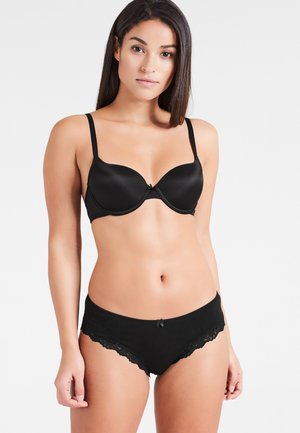 Zwart bikini-set met kantafwerking en een gepadded draadloos bh, voorzien van een gladde stof, verstelbare bandjes en een kleine strikdetail in het midden.