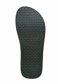 Sole of a black flip-flop with oval-shaped textured pattern on rubber material, isolated on white background.