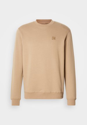 Beige sweatshirt made of soft cotton blend, features a round neck, long sleeves, and a small square logo patch on the left chest.