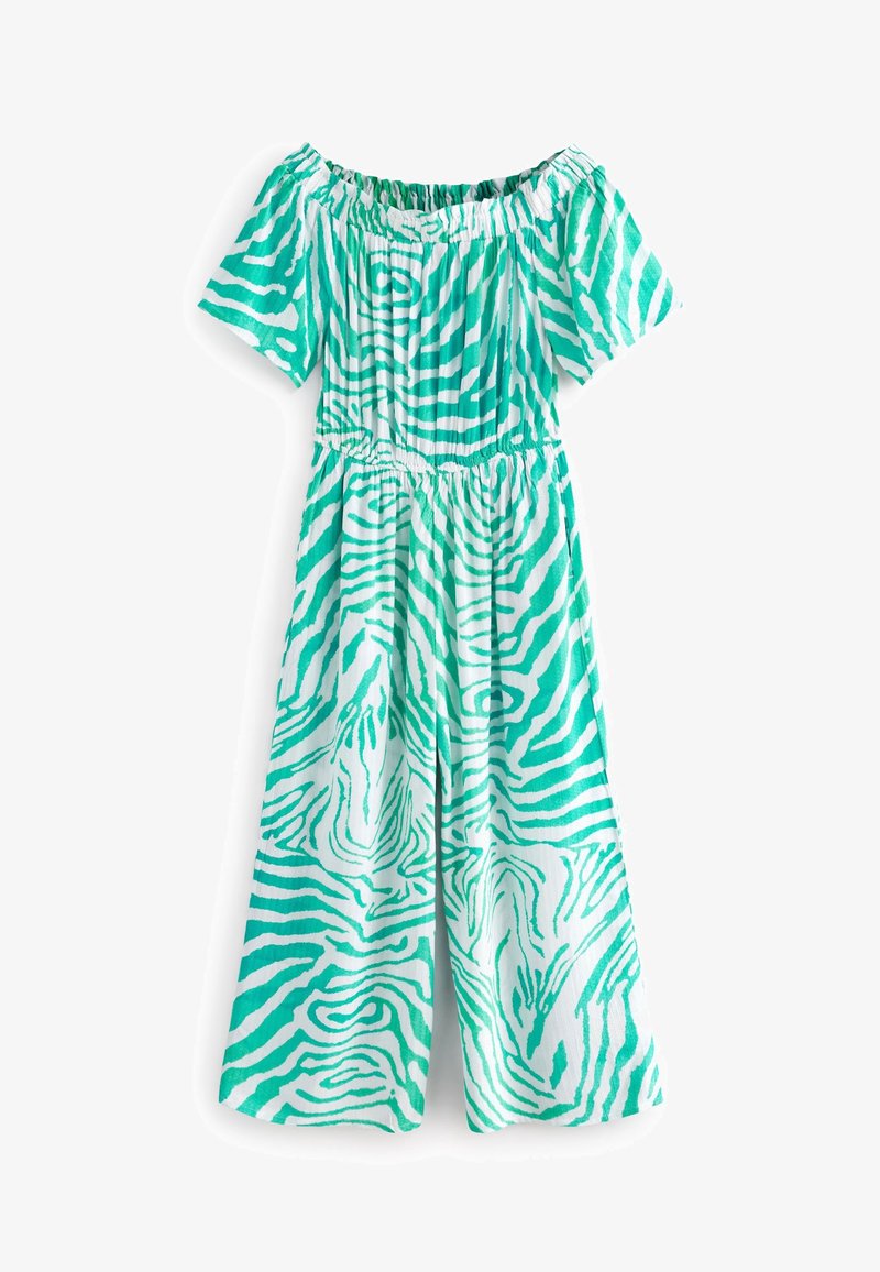 Combinaison pantalon jambes larges imprimé zèbre vert et blanc, manches courtes et encolure élastique décolletée.