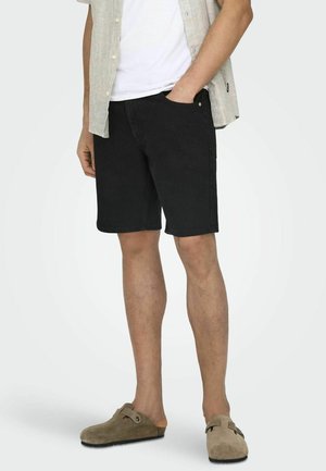 Zwarte denim shorts met een rechte snit. Beschikt over twee zijzakken, minimalistische stiksels en een effen kleurdesign. Casual pasvorm.