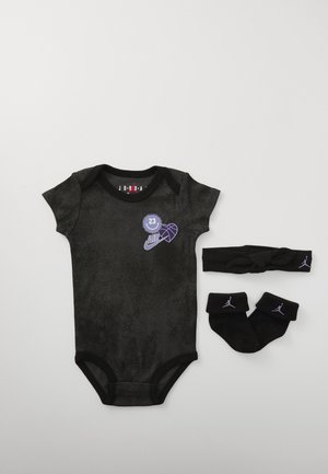 Black short-sleeve bodysuit made from soft fabric, featuring purple graphic accents. Accompanied by matching socks and a headband.