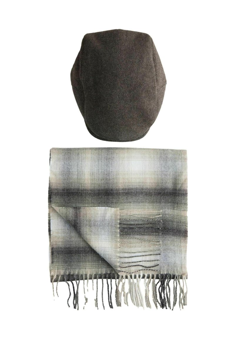 Dark gray flat cap above a folded gray plaid scarf with fringe on a white background.