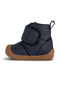 Navy blue toddler boot with a soft, padded exterior, velcro strap, and a brown rubber sole featuring a textured pattern for grip.