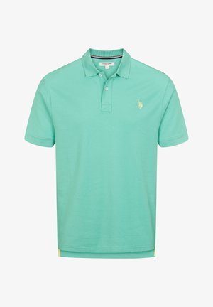 Polo turchese con colletto a coste, placca con due bottoni e un piccolo accento giallo all'orlo. Logo ricamato sul petto.