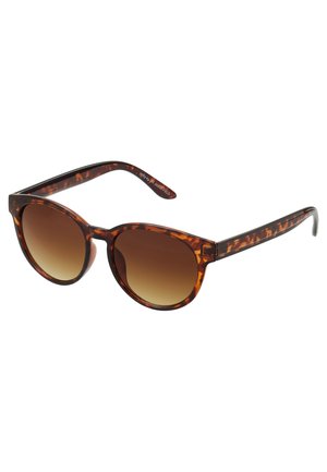 Tortoiseshell sunglasses with a vintage cat-eye shape, gradient brown lenses, and smooth, glossy finish on the frames and arms.