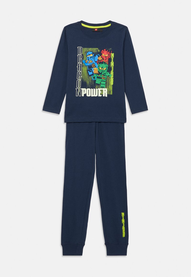 Navyblaue Pyjamas aus Baumwolle. Das langärmlige Oberteil zeigt ein buntes Drachen-Ninja-Motiv und den Text "DRAGON POWER". Hose mit elastischem Bund.