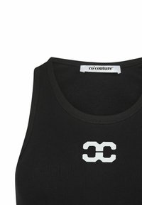 Black ribbed tank top with a round neckline and a white stylized logo in the center. The fabric appears stretchy and fitted.
