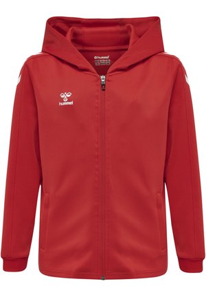 Röd zip-up huva jacka med vit Hummel-logga på bröstet och vita chevronränder på axlarna och ärmarna.