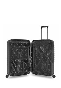 Valise rigide noire avec une double fermeture éclair, des compartiments intérieurs, des poches en maille et une poignée télescopique. Surface texturée avec motif de logo.