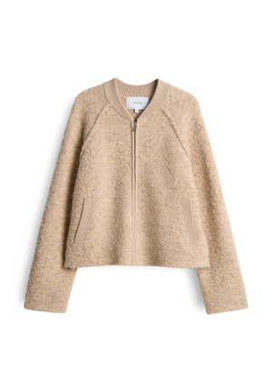 Giacca beige con zip realizzata in tessuto testurizzato. Presenta maniche raglan, colletto a coste e tasche laterali. Design corto.