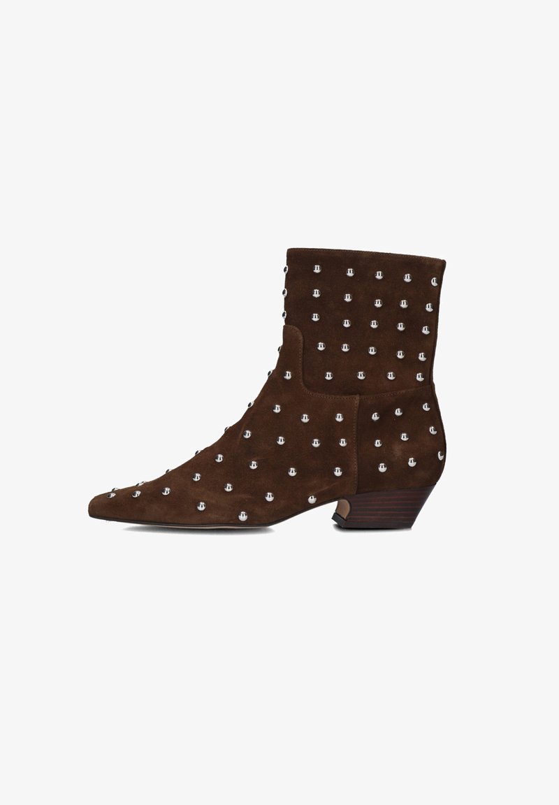 Brown suede ankle boot with low stacked heel, pointed toe, and evenly spaced silver studs covering the surface.