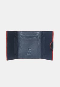 Navy blue leather wallet with red accents, featuring multiple card slots, smooth texture, and a snap closure. RFID logo embossed inside.