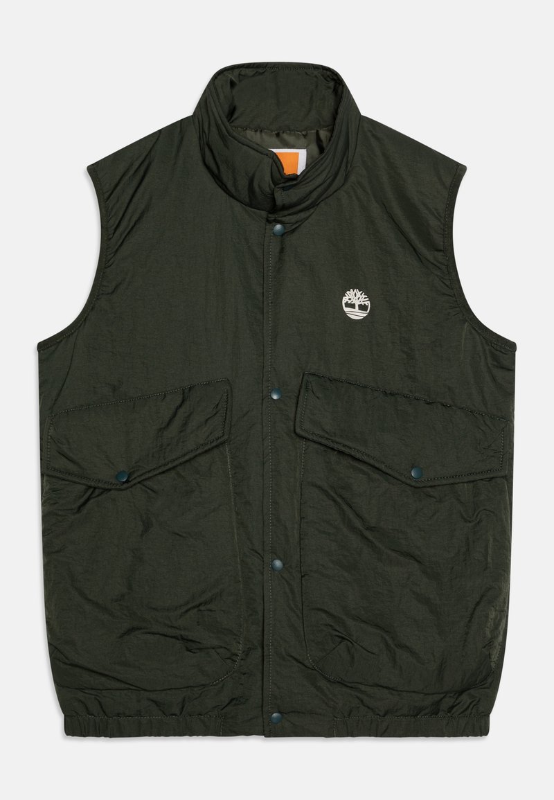 Veste sans manches vert foncé avec col haut, boutons-pression à l'avant, deux poches à rabat et petit logo d'arbre blanc sur la poitrine gauche.