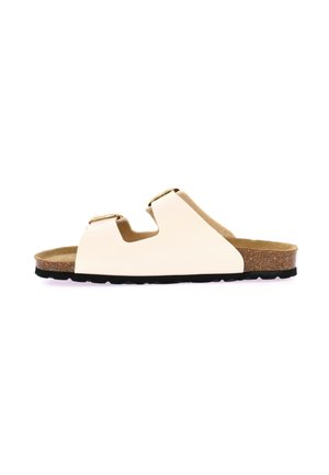Sandalo a scivolo con suola in sughero di colore crema, dotato di due cinturini regolabili e accessori in oro. Presenta una soletta morbida e una suola in gomma nera per una maggiore aderenza.