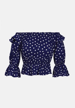 Mørkeblå off-shoulder bluse med hvide prikker, flæsekant ved halsen, elastik i taljen og udvidede trekvartærmer.