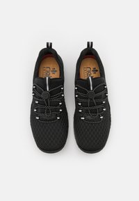 Black lightweight shoes with a mesh upper, elastic laces, and round toggle. Features a textured sole and a contrasting red interior.