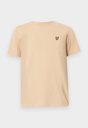 Ljust beige bomullströja med rund hals och korta ärmar, med en liten svart och gul fjärilslogotyp på vänster bröst.