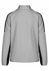 Lichtgrijze jas met een hoge kraag, lange mouwen en zwarte zijpanelen. Gladde stoftextuur, ontworpen voor casual gebruik.