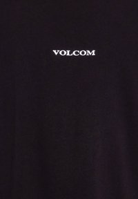 Black t-shirt made of cotton with a small white "VOLCOM" logo displayed on the chest. Simple design, no patterns or additional accents.