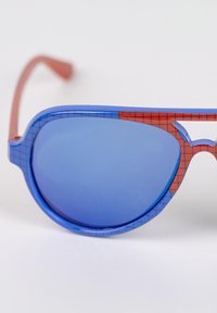 Sunglasses with a blue and red plastic frame, featuring a grid pattern and blue tinted lenses. Straight arms with a smooth finish.
