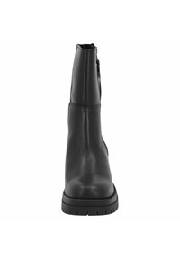 Black leather ankle boot with a smooth finish, rounded toe, and rugged rubber sole. Features a side zip for ease of wear.