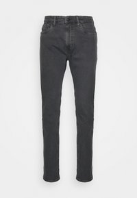 Jeans de mezclilla negra con un ajuste Slim, diseño de cinco bolsillos y cierre de botón. Presentan costuras sutiles y una textura suave.