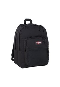 Sac à dos en tissu noir avec deux compartiments zippés, une poche en mesh à l'avant, des bretelles rembourrées et une poignée sur le dessus pour un transport facile.