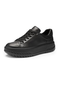 Black leather sneaker with thick textured sole, round toe, lace-up front, and low ankle collar, shown against a white background.