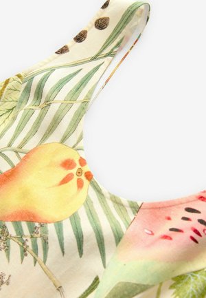 Floral-patterned fabric featuring green leaves, yellow and pink fruits, with a smooth texture and a curved neckline design.