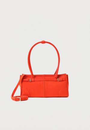 Rectangular small orange handbag with double handles, detachable long strap, and buckle details on a light background.