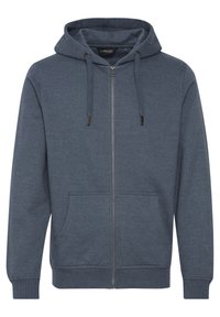 Veste à capuche zippée en bleu marine, fabriquée en mélange de coton. Elle dispose d'une capuche avec cordon de serrage, de poches avant, et de poignets et ourlet côtelés.