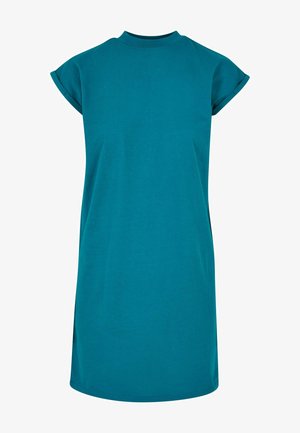 Zöld T-puló ruha magas nyakkal, rövid ujjal és laza szabással. Puha pamutanyagból készült, egyszerű, dísztelen dizájnnal.