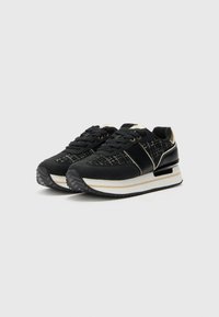 Black athletic shoes with textured fabric, gold accents, and a white midsole. Features a round toe and a durable rubber outsole.