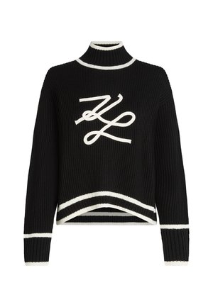 Black knitted sweater with a high neckline, white accents at the cuffs and hem, featuring a prominent white logo graphic on the front.