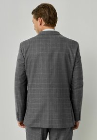 Grau karierte Sakkojacke aus strukturiertem Stoff, mit einem Schlitz, Reverskragen und knöpfbaren Manschetten für eine maßgeschneiderte Passform.