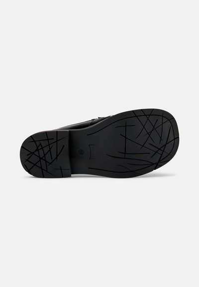 Black rubber shoe sole featuring a textured grip pattern with intersecting lines. The edge is slightly curved and solid in shape.