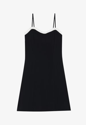 Black dress with thin straps, fitted bodice, and flared hem. White ruffled trim along the neckline. Smooth, lightweight fabric.