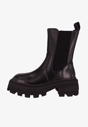 Black ankle boots with a glossy leather finish, elastic side panels, and sturdy, textured rubber sole featuring a chunky tread design.