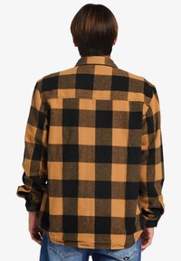 Buffalo check flanellen overhemd in zwart en mosterdgeel met lange mouwen, knoopsluiting kraag en een rechte zoom. Gecoate stof.