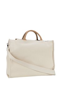 Beige Canvas-Handtasche mit glatten, braunen Ledergriffen, einem verstellbaren Schulterriemen und einem schlichten rechteckigen Design. Sichtbare Nähte setzen Akzente.