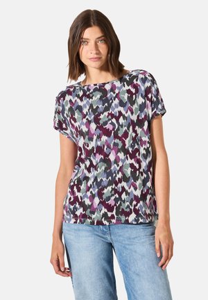 T-shirt à manches courtes dans un motif abstrait multicolore, alliant des nuances de violet, vert et bleu. Tissu doux avec une coupe décontractée et un col rond.