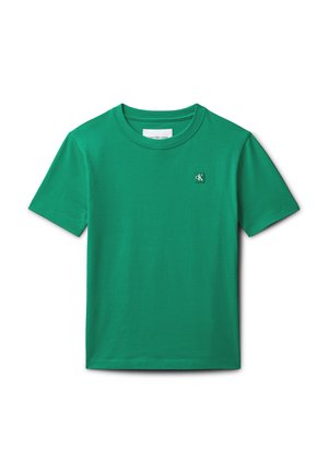 T-shirt vert à manches courtes et col rond avec un petit logo "ck" sur la poitrine gauche.