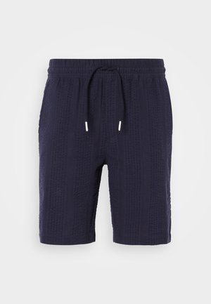 Marineblauwe shorts met een textuurpatroon, elastische tailleband en koordsluiting. Heeft een relaxte pasvorm en een lengte boven de knie.